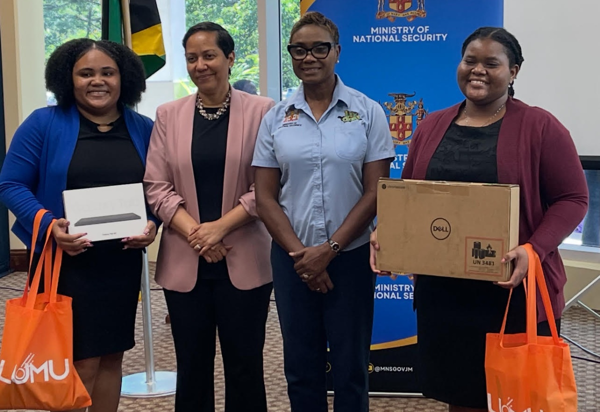 Minister of State in the Ministry of National Security and Peace, Hon. Juliet Cuthbert Flynn (second right) and Resident Representative, Organization of American States (OAS), Office of the General Secretariat in Jamaica, Jeanelle van Glannen Weygel (second left) share a photo opportunity with members of the Jamaica Cyber Incident Response Team (Ja-CIRT), Monique Satchwell (right) and Rheana Hagigal who copped first place in the overall team category of the SheSecures Jamaica Cybersecurity Competition during the award ceremony at the University of the West Indies, Regional headquarters in Mona, Kingston on October 10.