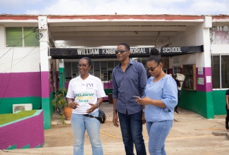 General Manager of Free Your Image Consultancy Group, Paula Pinnock (left), Principal of William Knibb Memorial High School, Linvern Wright (centre), and General Manager of JN Foundation, Claudine Allen (right), share a moment at the post-hurricane Melissa support project staged by For Your Image Consultancy (FYI) and Friends, at William Knibb Memorial High in Falmouth, Trelawny, on Wednesday (November 5).