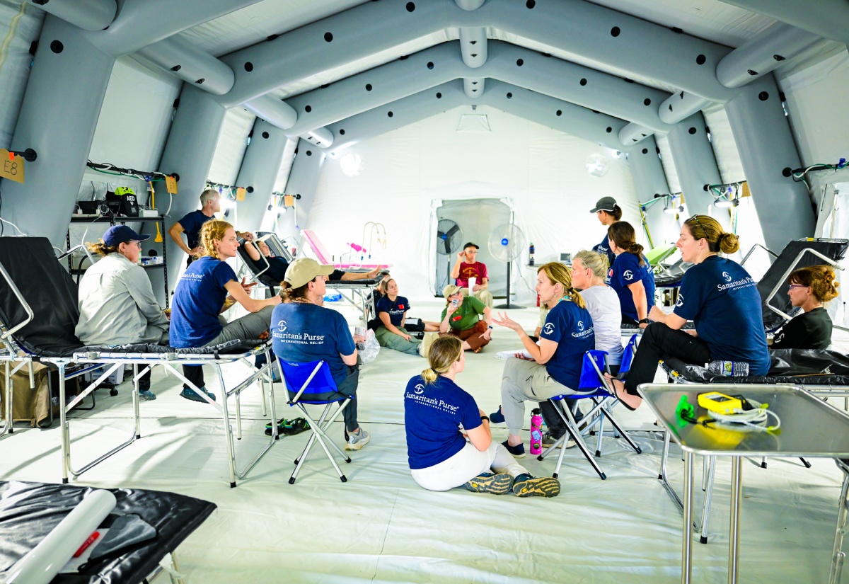 Members of the Samaritan’s Purse International Relief Disaster Assistance Response Team (DART), which will be offering medical treatment at the Emergency Field Hospital located at Black River High School in St. Elizabeth, meet on Tuesday (November 4) during a tour of the facility. The temporary facility is outfitted with a full pharmacy and laboratory and is capable of carrying out the functions of the Black River Hospital in the parish.