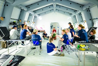 Members of the Samaritan’s Purse International Relief Disaster Assistance Response Team (DART), which will be offering medical treatment at the Emergency Field Hospital located at Black River High School in St. Elizabeth, meet on Tuesday (November 4) during a tour of the facility. The temporary facility is outfitted with a full pharmacy and laboratory and is capable of carrying out the functions of the Black River Hospital in the parish.