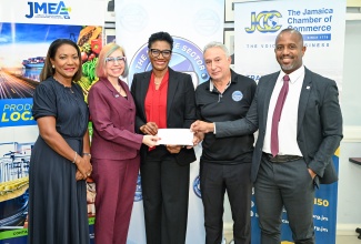 Jamaica Banker’s Association (JBA) President, Audrey Tugwell Henry (centre), hands over a cheque valued $5 million to Private Sector Organisation of Jamaica (PSOJ) President, Metry Seaga (second right), towards the PSOJ’s Hurricane Melissa Relief Effort. Sharing in the presentation are (from left) JBA Chief Executive Officer, Barbara Hume; Jamaica Manufacturers and Exporters Association (JMEA) President , Kathryn Silvera; and Jamaica Chamber of Commerce (JCC) President, Emile Leiba. The handover ceremony was held on Wednesday (November 19) at the PSOJ’s offices in Kingston.

