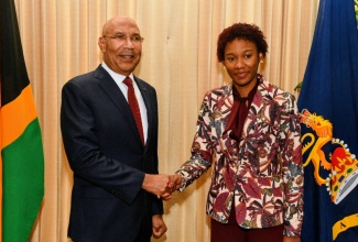 Governor-General, His Excellency the Most Hon. Sir Patrick Allen (left), shares a photo opportunity with 2026 Rhodes Scholar, Tiana Dinham, during Thursday’s (November 13) announcement ceremony at King’s House.

