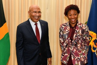 Governor-General, His Excellency the Most Hon. Sir Patrick Allen, shares a light moment with 2026 Rhodes Scholar, Tiana Dinham, during the official announcement ceremony at King’s House on November 13.

