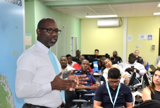 Corporate Public Relations Manager at the National Water Commission (NWC), Delano Williams, speaking at a daily briefing at the National Emergency Operations Centre (NEOC), located at the Office of Disaster Preparedness and Emergency Management (ODPEM) in Kingston on November 24.

