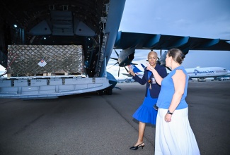 Minister of Finance and the Public Service, Hon. Fayval Williams (left), and Ambassador of Belgium to Jamaica, Ellen De Geest, welcome the arrival of 200 generators donated by the Government of Belgium to support the island