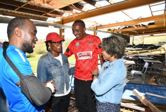 Minister of Education, Skills, Youth and Information, Senator Dr. the Hon. Dana Morris Dixon (right), speaks with (from left) Chairman of the St. Elizabeth Technical High School, Yaneke Watson; teacher at the school, Dania Allen Isaacs, who is also a student welfare coordinator; and Principal, Keith Wellington.