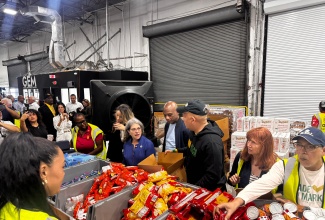 Global Empowerment Mission (GEM) team members prepare relief items to send to Jamaica. 