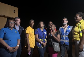 Permanent Secretary in the Ministry of Labour and Social Security, Dione Jennings (fourth left), listens as Deputy Director of Nursing Services at the Black River Hospital, Ingrid Stephens (third right), expresses gratitude for the donation of food, water and care packages to the patients and staff at the hospital by the Ministry along with its humanitarian assistance partners. The items were handed over at the hospital in St. Elizabeth on Thursday night (Oct. 30). From left  are: Chief Technical Director in charge of Social Security in the Ministry,  Audrey Deer Williams; Caribbean Country Director, World Food Programme (WFP), Brian Bogart; Chief Executive Officer at the Black River Hospital, Diana Brown-Miller;  Acting Director for Disaster, Rehabilitation and Welfare Management in the Ministry, Jacqueline Shepherd; Food for the Poor Director in charge of operations and implementation, Nakhle Hado;  and Acting Director for Disaster Rehabilitation and Welfare Management in the Ministry of Labour and Social Security, Suzette Morris.