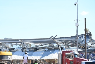 The police in St. Elizabeth maintaining a presence as recovery efforts in Black River are underway in the aftermath of Hurricane Melissa.