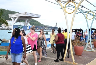 Cruise passengers from the Carnival Sunrise make their way along the reopened main terminal at Ocho Rios Port in St. Ann, on Wednesday, November 12.