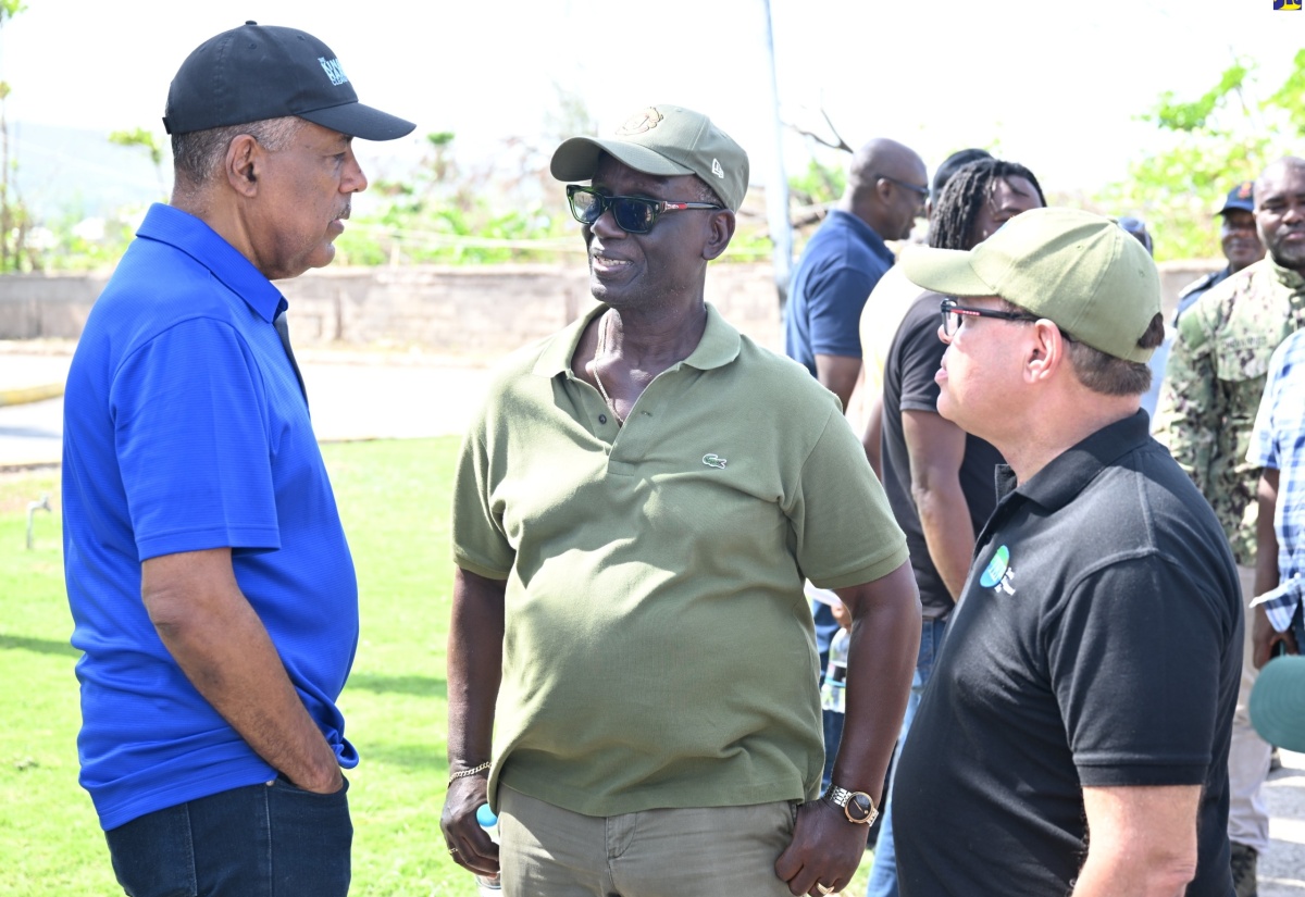 Minister of Local Government and Community Development, Hon. Desmond McKenzie (centre), converses with President and Chief Executive Officer of the Port Authority of Jamaica (PAJ), Professor Gordon Shirley (left), and Chairman of the Tourism Product Development Company (TPDCo), Ian Dear, during a visit to Falmouth, Trelawny, on Saturday (November 29).

