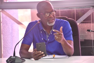 Director of Customer Solutions at the Jamaica Public Service (JPS), Leroy Reid, gives remarks during a follow-up Emergency Operations Centre (EOC) meeting, held at the St. James Municipal Corporation on Friday (October 31). 

