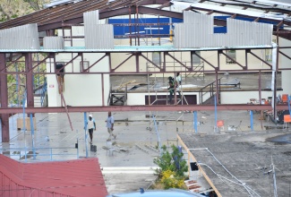 Volunteers repair a building at the Westwood High School for Girls in Trelawny, during a repair and clean up exercise at the school on Friday ( November 21).
