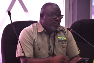 Regional Operations Manager at WPM Waste Management Ltd., Dramaine Jones, gives remarks during an Emergency Operations Centre (EOC) meeting held at the St. James Municipal Corporation on November 6. 

