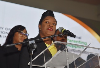 National Parenting Support Commission (NPSC) Chief Executive Officer, Kaysia Kerr, addresses the launch of National Parent Month on Wednesday (November 12) at Tivoli Gardens High School in Kingston.

