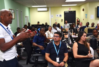 Manager for Grid Interconnection, Engineering Service at the Jamaica Public Service Company (JPS), Errington Case (left),provides an update on post-Hurricane Melissa restoration efforts during Monday’s (November 24) daily briefing at the National Emergency Operations Centre (NEOC), Office of Disaster Preparedness and Emergency Management (ODPEM), in Kingston.

