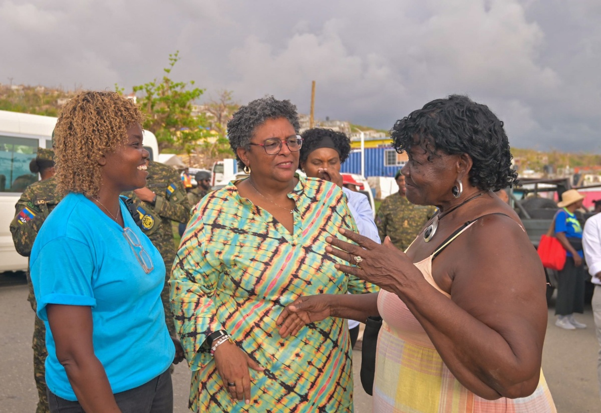 Prime Minister of Barbados, Hon. Mia Mottley (centre), speaks with residents of Whitehouse in Westmoreland, during a visit by several CARICOM Heads of Government to the community on Monday (November 17). 


