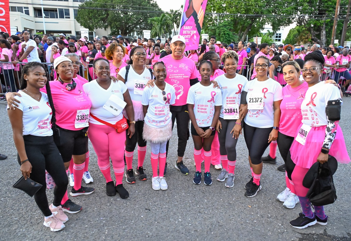 Prime Minister, Dr. the Most Hon. Andrew Holness (centre), sharing a moment with participants in the Jamaica Reach 2 Recovery (JR2R) Pink Run on Sunday (November 17) at Emancipation Park in St. Andrew. 