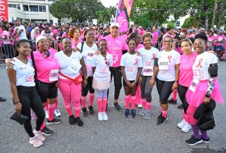 Prime Minister, Dr. the Most Hon. Andrew Holness (centre), sharing a moment with participants in the Jamaica Reach 2 Recovery (JR2R) Pink Run on Sunday (November 17) at Emancipation Park in St. Andrew.