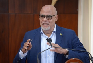 Chairman of the Private Sector Coordination Committee, Senator Keith Duncan, adresses a press briefing at Jamaica House on Thursday (November 6).

