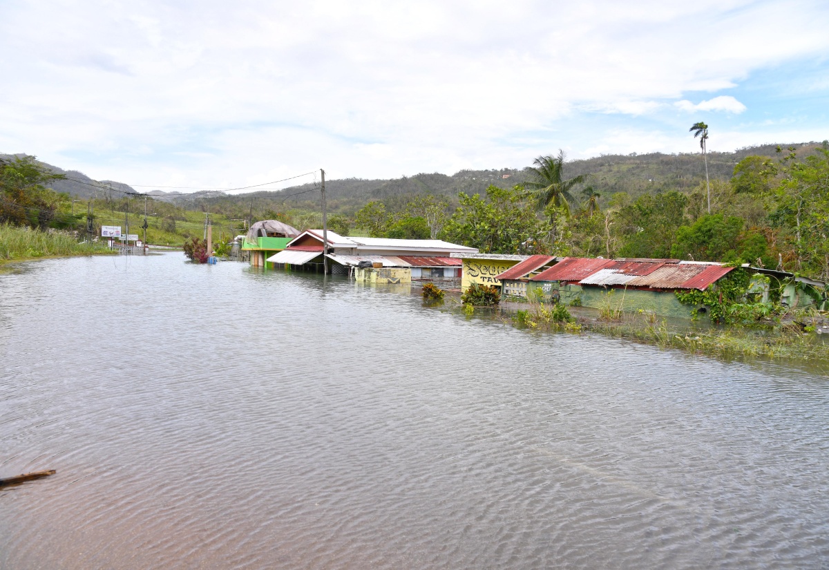 Rising water levels at Content in Williamsfield, Manchester, which have inundated homes and business establishments.


