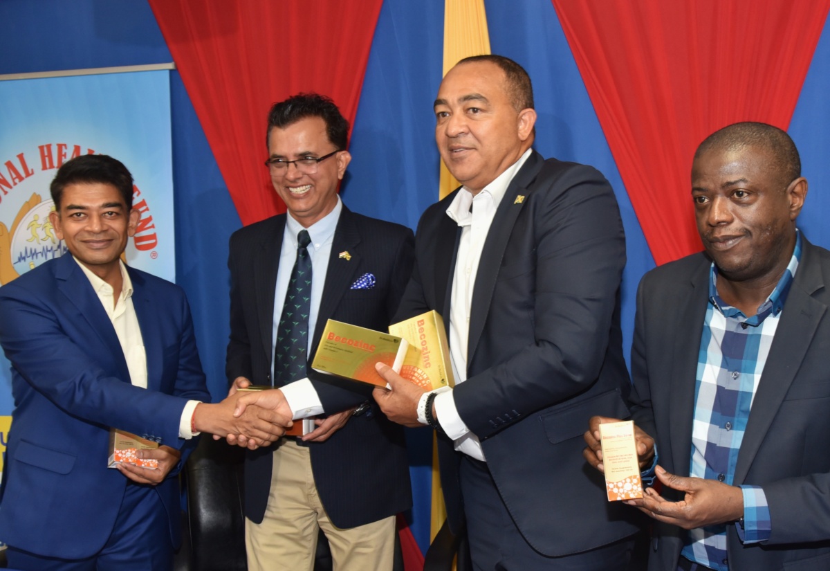 Minister of Health and Wellness, Dr. the Hon. Christopher Tufton (third left), along with (from left) Country Head and Director of Dr. Reddy’s Laboratories, Preetdarshi Patnaik; First Secretary at the High Commission of India in Jamaica, Yash Pal Singh; and Chief Executive Officer of the National Health Fund (NHF), Everton Anderson, display some of the medications and vitamins donated by Dr. Reddy’s Laboratories, in support of hurricane relief efforts, during a handover ceremony, held on November 25, at the offices of the NHF in New Kingston.

