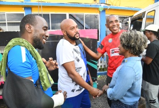 Minister of Education, Skills, Youth and Information, Senator Dr. the Hon. Dana Morris Dixon (right), greets Santa Cruz-based businessman, Edward Hines (second left), during a visit to the St. Elizabeth Technical High School on Sunday (November 2). Sharing the moment (from left) are Chairman of the school, Yaneke Watson and Principal, Keith Wellington. Mr. Hines was instrumental in facilitating the contribution of a generator by Romeich Major of Romeich Entertainment for the pumping of water to serve the institution and the wider community.