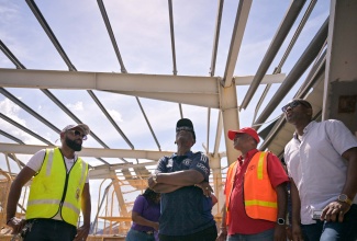 Minister of Local Government and Community Development, Hon. Desmond McKenzie (second left), surveys extensive damage to the Black River Market in St. Elizabeth, following the passage of Category Five Hurricane Melissa on October 28. He is joined by Mayor of Black River and Chairman of the St. Elizabeth Municipal Corporation, Councillor Richard Solomon (left), along with other key stakeholders. The assessment formed part of a tour and relief distribution exercise conducted in Black River on November 1.