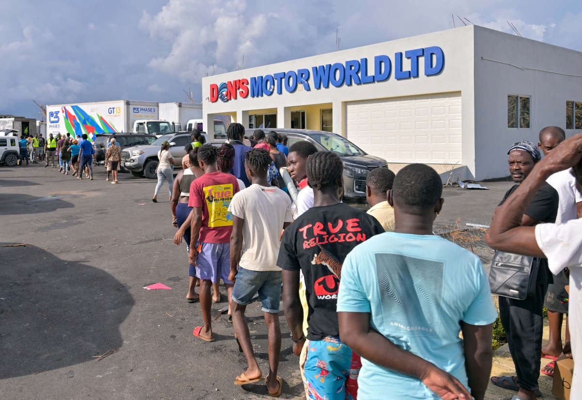 Residents of Black River, St. Elizabeth, who were severely affected by Hurricane Melissa, waiting in line to receive care packages and other essential relief items on Saturday (November 1).


