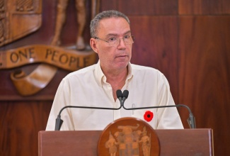 Minister of Energy, Transport and Telecommunications, Hon. Daryl Vaz, addresses a press conference at Jamaica House on Tuesday (November 11).

