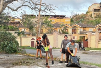 Employees of Hah-R-Mony Entertainment Limited assist with post-Hurricane Melissa cleanup efforts in Montego Bay, St. James.

