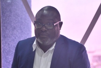 Regional Operations Manager, WPM Waste Management Limited, Dramaine Jones, gives remarks during the monthly meeting of the St. James Municipal Corporation held in Montego Bay on November 13. 

