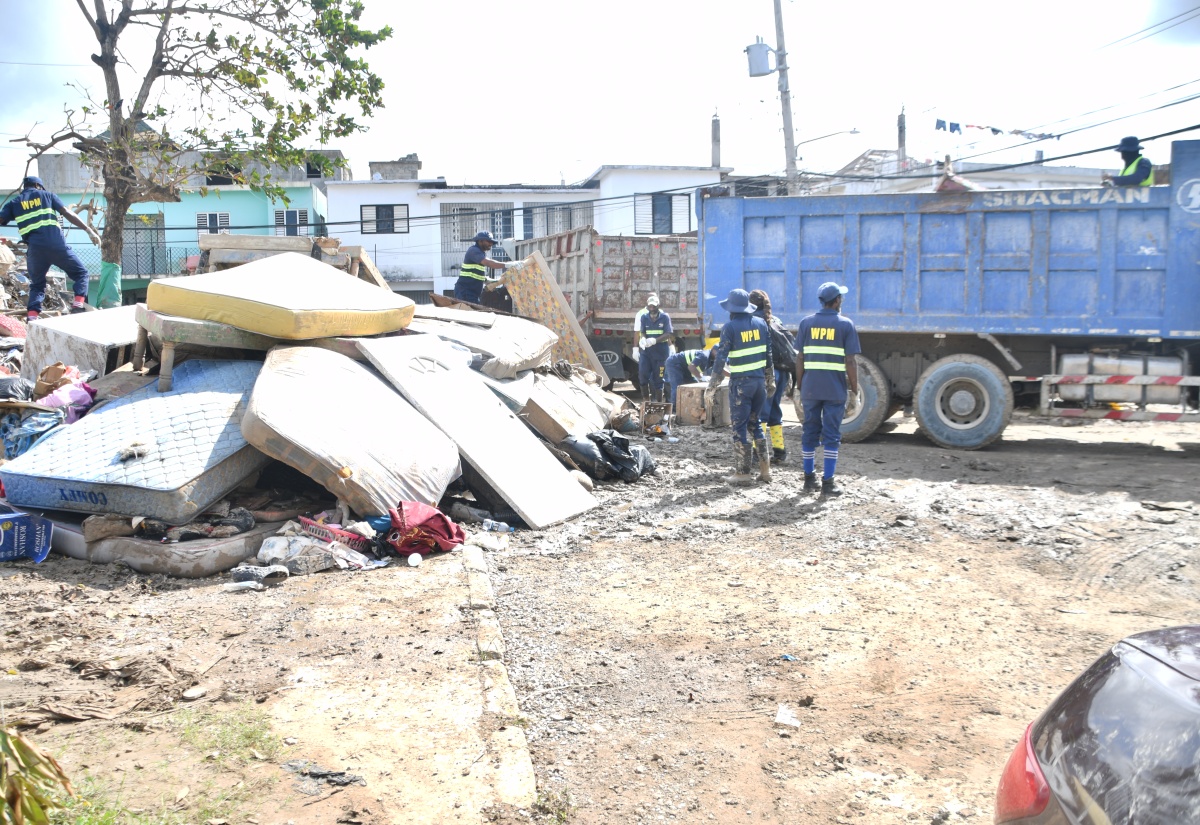 Team members of the National Solid Waste Management Authority (NSWMA) carry out clean-up activities in Catherine Hall, St. James on Tuesday (Nov. 4). 


