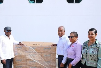 Tourism Minister, Hon. Edmund Bartlett (left), receives urgently needed hurricane relief supplies from Carnival Corporation at Reynolds Pier, Ocho Rios, St. Ann, on Tuesday (November 4). Joining him are Port Authority of Jamaica (PAJ) President and Chief Executive Officer, Professor Gordon Shirley; Executive Director, Jamaica Vacations (JAMVAC), Joy Roberts; and Assistant Vice President for Marketing and Communications at PAJ, Kimberly Stiff,.