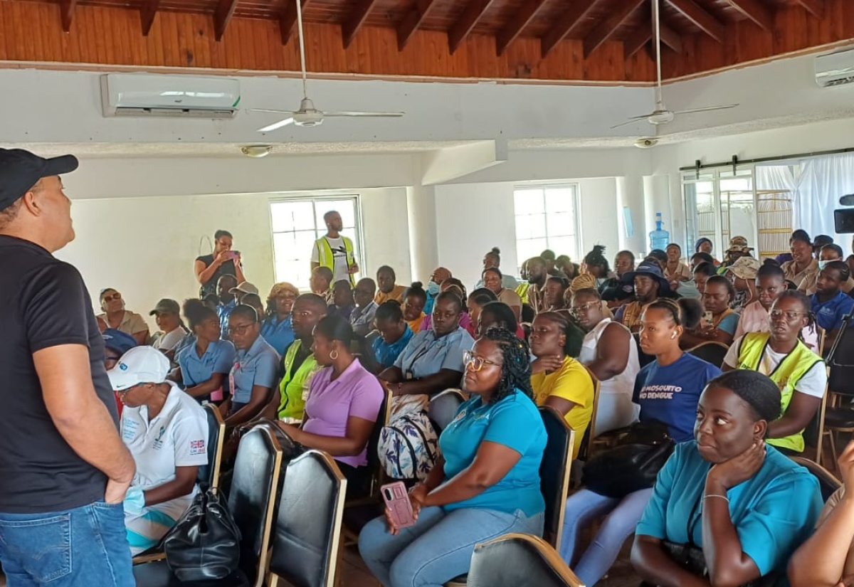 Minister of Health and Wellness, Dr. the Hon. Christopher Tufton, addresses a recent meeting with public health workers at Hotel Commingle in Savanna-la-Mar, Westmoreland.

