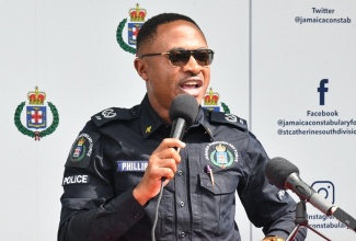 Assistant Commissioner of Police (ACP) Christopher Phillips, who has responsibility for Area Five, addresses the launch of the 'Shop with a Cop' initiative at the Greater Portmore Police Station (100-Man) in St. Catherine on Friday (Dec.19).