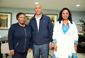 Chief Technical Director, Ministry of Foreign Affairs and Foreign Trade, Ambassador Sharon Miller (left), shares a photo opportunity with Ethiopia’s State Minister of Foreign Affairs, Ambassador Berhanu Tsegaye (centre), and Honorary Consul for Ethiopia in Jamaica, Yodit Hylton (right), shortly after the arrival of an Ethiopian delegation at the Norman Manley International Airport in Kingston on Wednesday (December 3).

