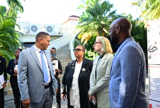 State Minister in the Ministry of Labour and Social Security, Hon. Donovan Williams (left), in discussion with (from second left) Managing Director of Make Your Mark Group, Dr. Jacqueline Coke-Lloyd; Jamaica Manufacturers & Exporters Association (JMEA) President, Kathryn Silvera; and Founding & Senior Pastor at Transformed Life Church, Bishop Dwight Fletcher, ahead of the opening ceremony for the Business & Personal Etiquette Conference 2025 hosted by Make Your Mark Consultants. The event was held on Monday (December 1) at the Terra Nova All-Suite Hotel in Kingston under the theme ‘The New Rules of Engagement’.

