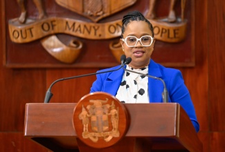 Students’ Loan Bureau (SLB) Executive Director, Nickeisha Walsh, addressing Wednesday’s (December 3) post Cabinet press briefing at Jamaica House.

