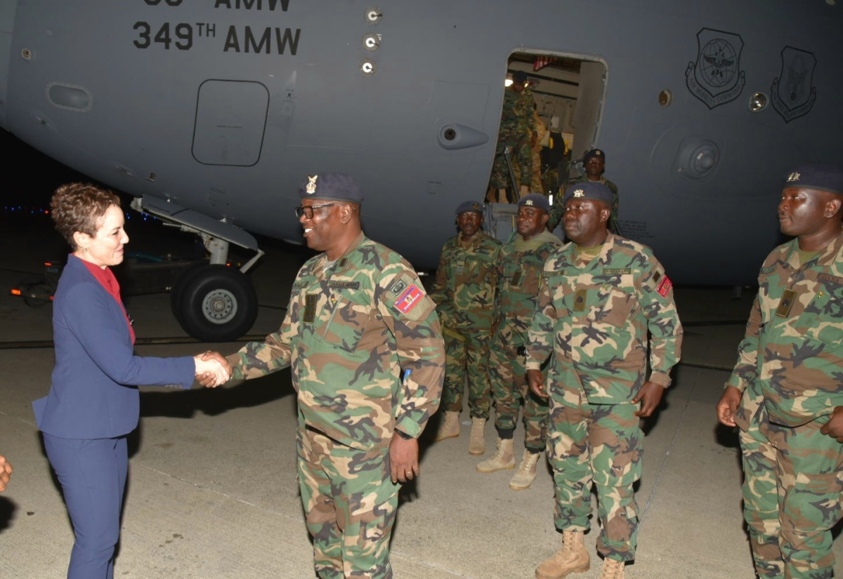 Minister of Foreign Affairs and Foreign Trade, Senator the Hon. Kamina Johnson Smith (left), greets Head of the Ghanaian military team assigned to hurricane relief efforts in Jamaica, Colonel Emanuel Asia (second left), at the Norman Manley International Airport (NMIA), on December 18.