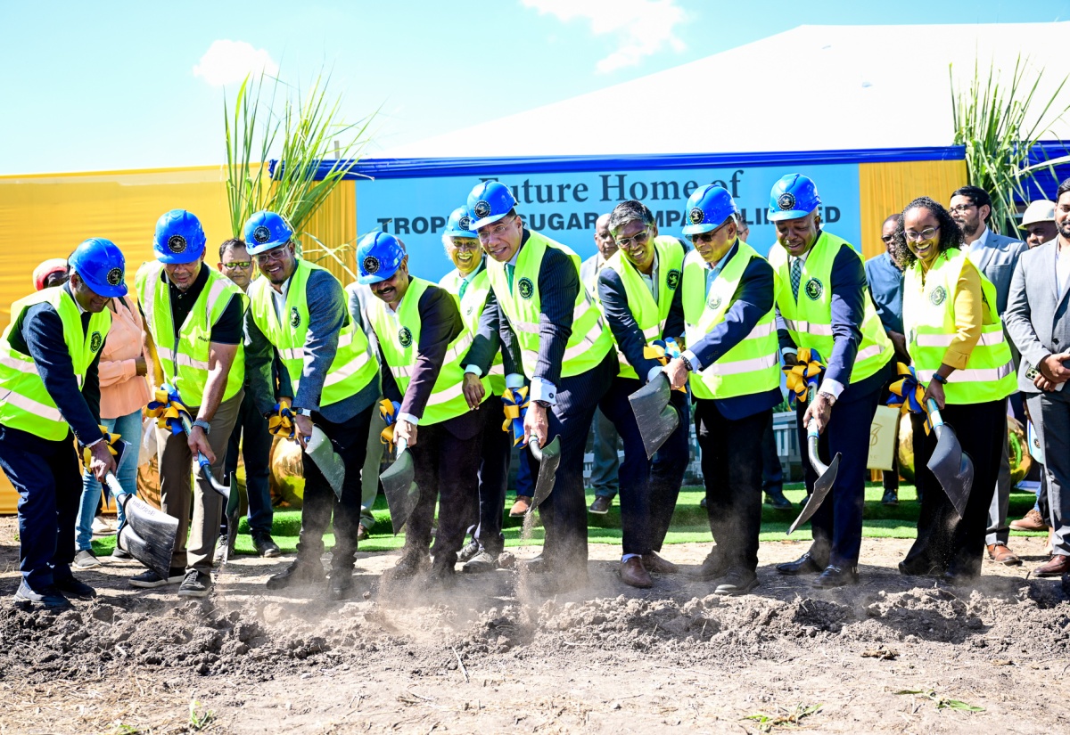 Prime Minister, Dr. the Most Hon. Andrew Holness (centre), participates in the breaking of ground for the US$50-million Tropical Sugar Company Limited in Chesterfield, Clarendon, on Tuesday (December 2).  He is joined by Minister of Agriculture, Fisheries and Mining, Hon. Floyd Green (third left); Chief Executive Officer (CEO) of Tropical Sugar Company Limited, Anil Jami (fourth left); Minister of Labour and Social Security and Member of Parliament for Clarendon South Eastern, Hon. Pearnel Charles Jr. (second right); Chief Executive Officer of Jamaica Promotions Corporation (JAMPRO), Shullette Cox, and other stakeholders. 

