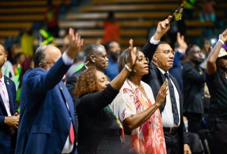 Prime Minister, Dr. the Most Hon. Andrew Holness (right); and his wife and Speaker of the House, the Most Hon. Juliet Holness (second right), take part in the service of celebration for the life of the late Hon. James “Jimmy Cliff” Chambers, OM, inside the National Indoor Sports Centre in Independence Park, on Wednesday (December 17). Also participating are Minister of Culture, Gender, Entertainment and Sport, Hon. Olivia Grange; and Leader of the Opposition, Mark Golding.

