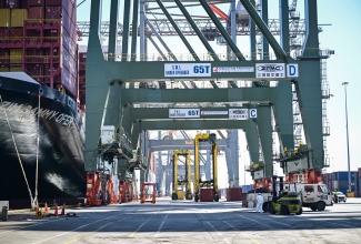 Kingston Freeport Terminal Limited’s new ship-to-shore cranes in operation at the Port in Kingston on Wednesday (December 3). 

