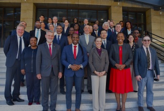 Minister of Foreign Affairs and Foreign Trade, Senator the Hon. Kamina Johnson Smith (centre, front row), State Minister Hon. Alando Terrelonge (second left, front row) and Permanent Secretary Sheila Sealy Monteith (second left, front row) share a photo with members of the diplomatic corps, following the Ministry’s end-of-year briefing at its office in downtown Kingston on Wednesday (December 3).

