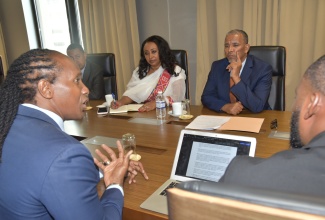 State Minister in the Ministry of Foreign Affairs and Foreign Trade, Hon. Alando Terrelonge (left), leads discussions during a courtesy call by the Ethiopian delegation at the Ministry’s offices in Kingston on Thursday (December 4). Listening are Honorary Consul for Ethiopia in Jamaica, Yodit Hylton (second right); Ethiopia’s State Minister for Foreign Affairs, Ambassador Berhanu Tsegaye (right); and other stakeholders.

