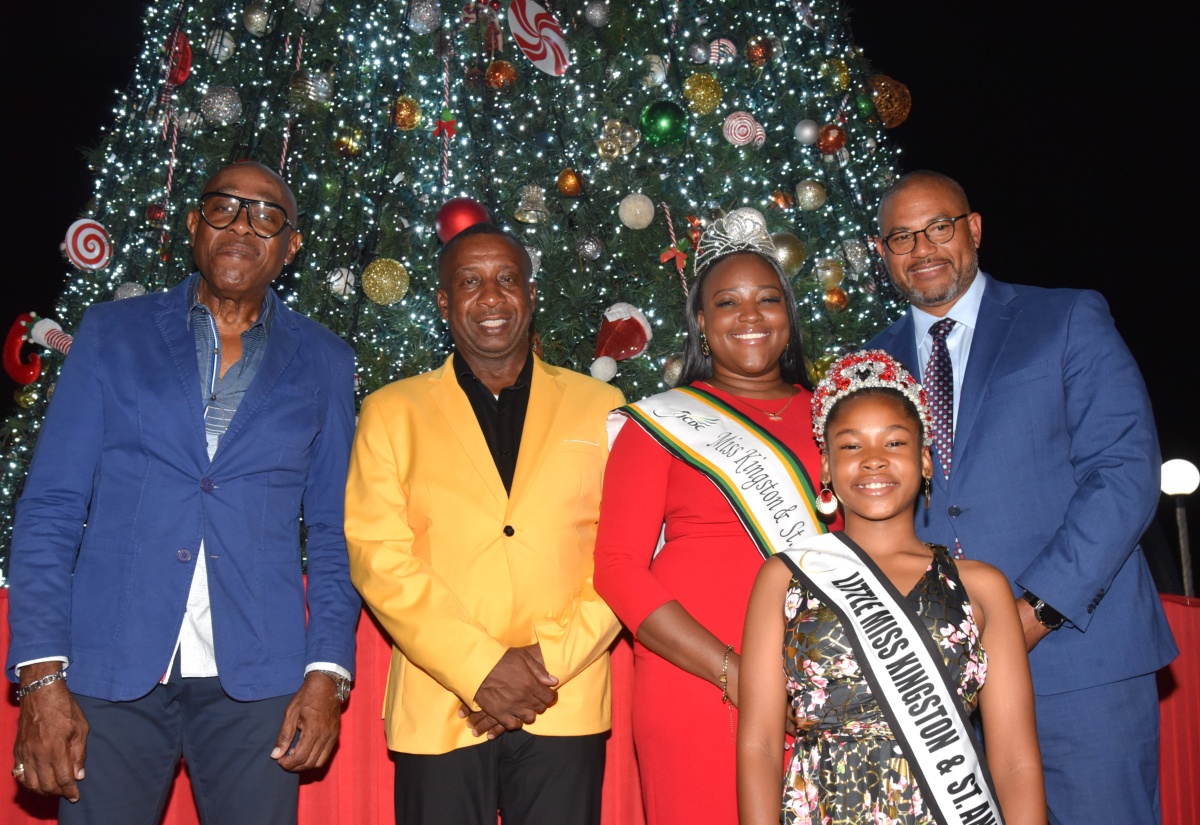 Mayor of Kingston, Councillor Andrew Swaby (second left), shares a photo opportunity with (from left) Custos of St. Andrew, Ian Forbes; Miss Kingston & St Andrew 2025 Festival Queen first runner-up, Johnique Francis; Little Miss Kingston & St. Andrew, Adaya Hudson; and Member of Parliament for Manchester North Western, Mikael Phillips, representing Opposition Leader, Mark Golding. Occasion was the Kingston and St. Andrew Municipal Corporation (KSAMC) Christmas Tree-Lighting Ceremony, held on Wednesday (December 9) at St. William Grant Park in downtown Kingston. 

