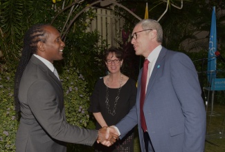 State Minister in the Ministry of Foreign Affairs and Foreign Trade, Hon. Alando Terrelonge (left), greets United Nations Children