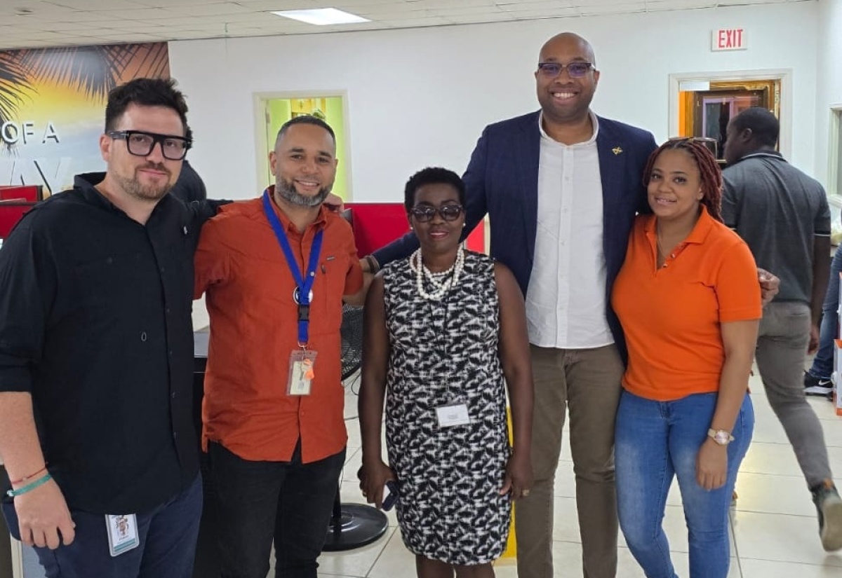 Minister of State in the Ministry of Industry, Investment and Commerce, Hon. Delano Seiveright (second right), shares a moment with members of the Concentrix management team during a recent visit to one of the company’s major operational hubs in the Montego Bay Free Zone in St. James. Also pictured (from left) are Concentrix executives – Senior Director, Real Estate, Pablo Rojas Morales, and Senior Manager, Facility Management, Ivan Estevez; Vice President, Business Process Outsourcing (BPO) and Logistics, Port Authority of Jamaica (PAJ), Gloria Henry; and Concentrix Senior Supervisor, Facility Management, Jada Fennell. Concentrix is a global technology and services leader operating in more than 70 countries, providing customer‑experience management and digital transformation solutions for leading international brands.

