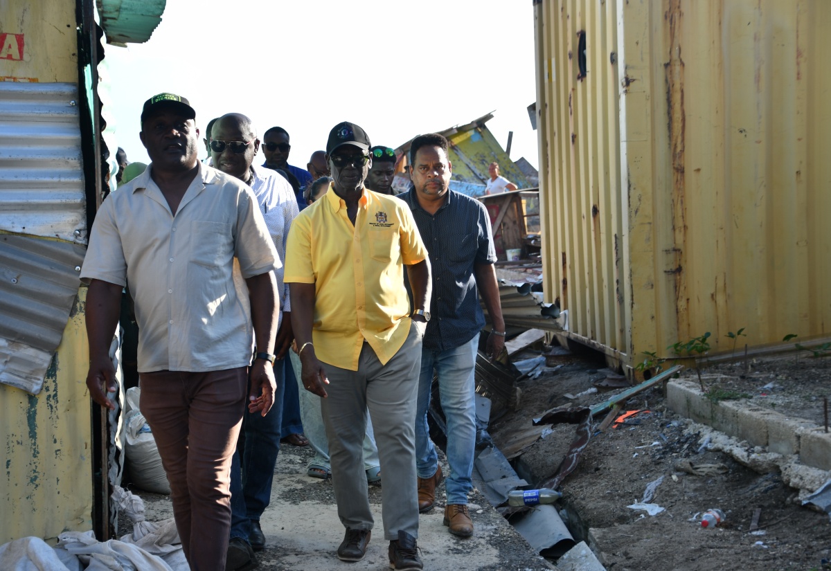 Minister of Local Government and Community Development, Hon Desmond McKenzie (second left), tours a section of the Savanna-La-Mar Market in Westmoreland on Wednesday (December 3), to assess the damage caused by the recent passage of Hurricane Melissa. Joining him are (from left) Councillor of the Little London Division, Ian Myles; Mayor of Savanna-la-Mar, Councillor Danree Delancy (partially hidden), and Chief Technical Director in the Ministry, Dwight Wilson. 

