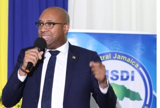 Minister of State in the Ministry of Industry, Investment and Commerce, Hon. Delano Seiveright, addresses graduates at the Central Jamaica Social Development Initiative (CJSDI) training programme graduation ceremony, held at the Golf View Hotel in Manchester, on Sunday, December 14.

